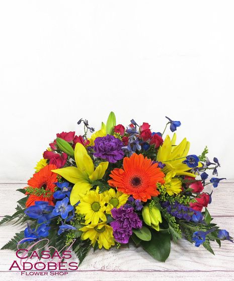 Vibrant Flowers in a round centerpiece 