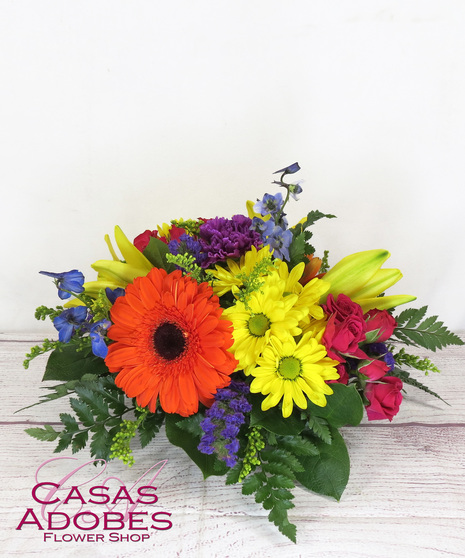 Vibrant Flowers in a round centerpiece 