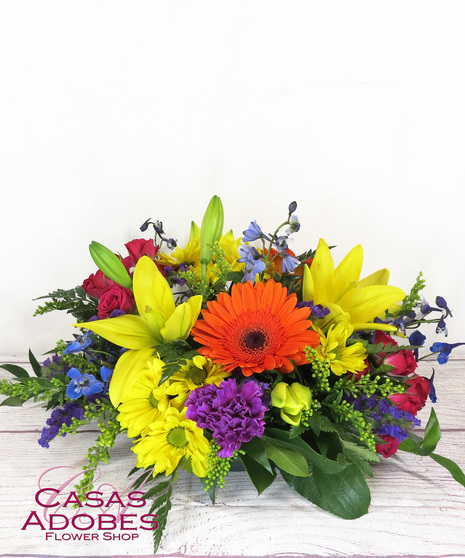 Vibrant Flowers in a round centerpiece 